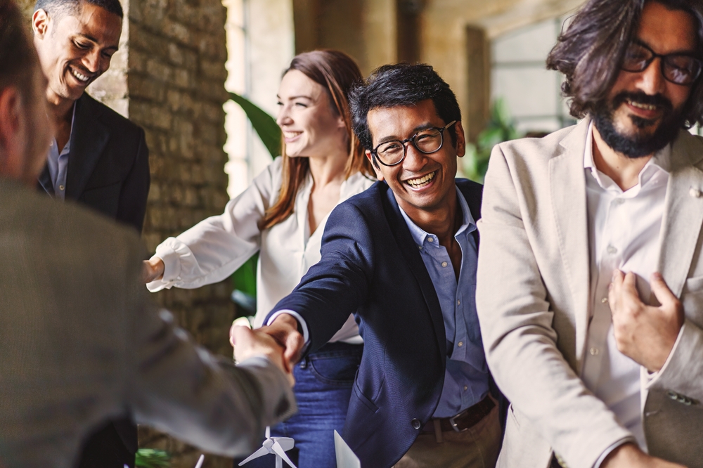 diverse professionals shaking hands