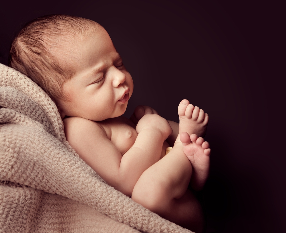 Newborn sleeping on Blanket