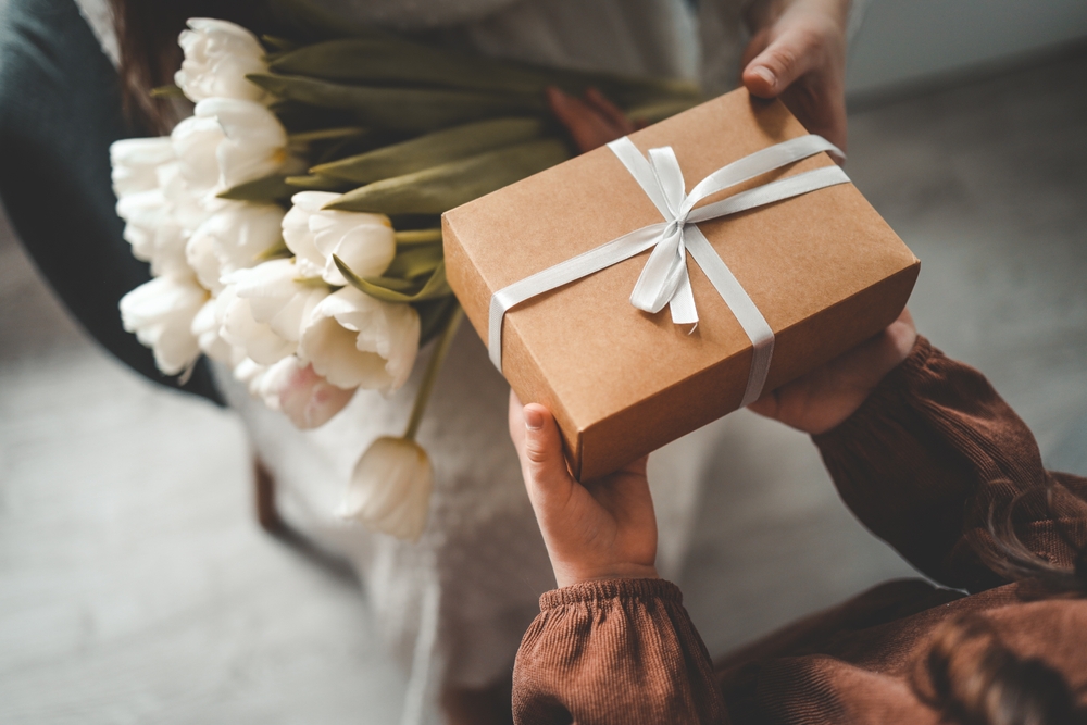 person receiving a holiday gift