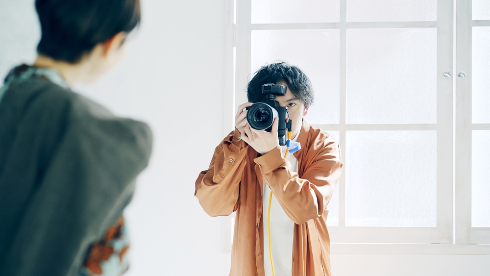 Photographer taking photo of a model in the studio