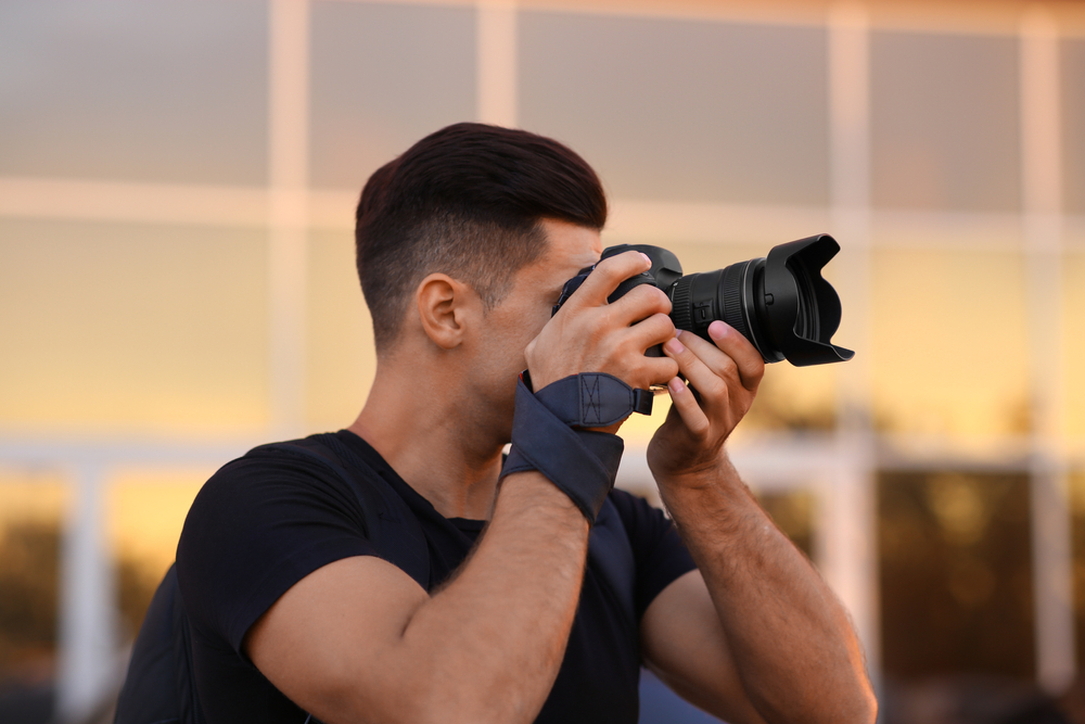 Photographer taking photos with a short lens