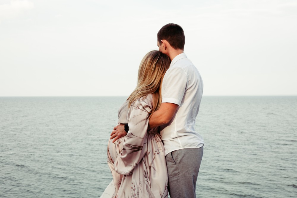 Pregnant Couple by the ocean