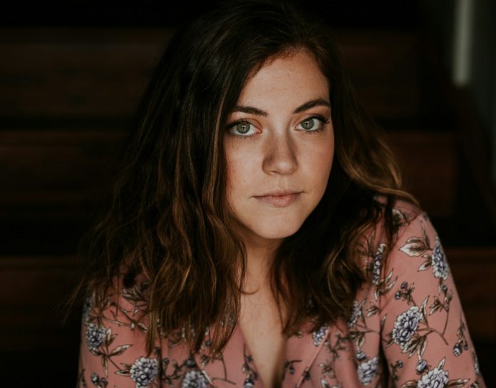 Woman in a peach top